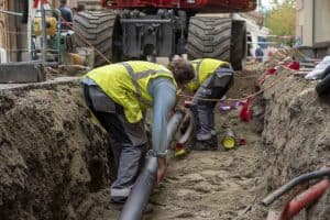 technicians performing traditional sewer line repair in Tarpon Springs, FL