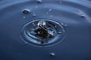 water droplet creating a ripple effect